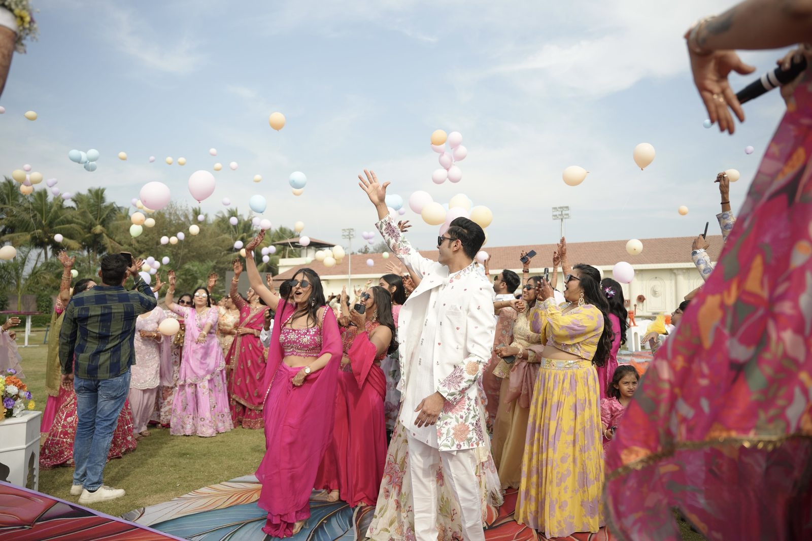 Pastel balloons released over a celebrating crowd