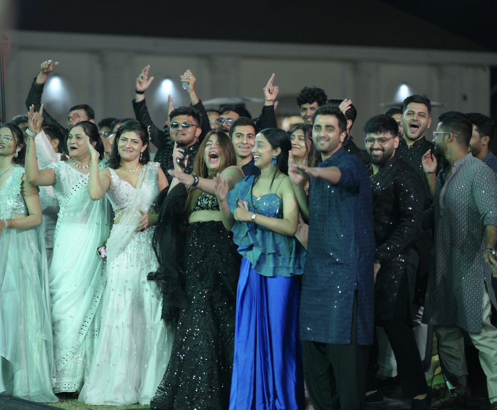 Guests laughing together at a sangeet evening