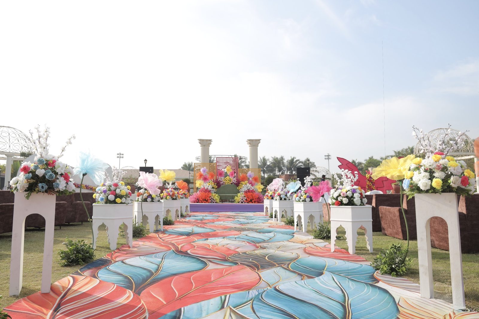 A colourful outdoor ceremony pathway